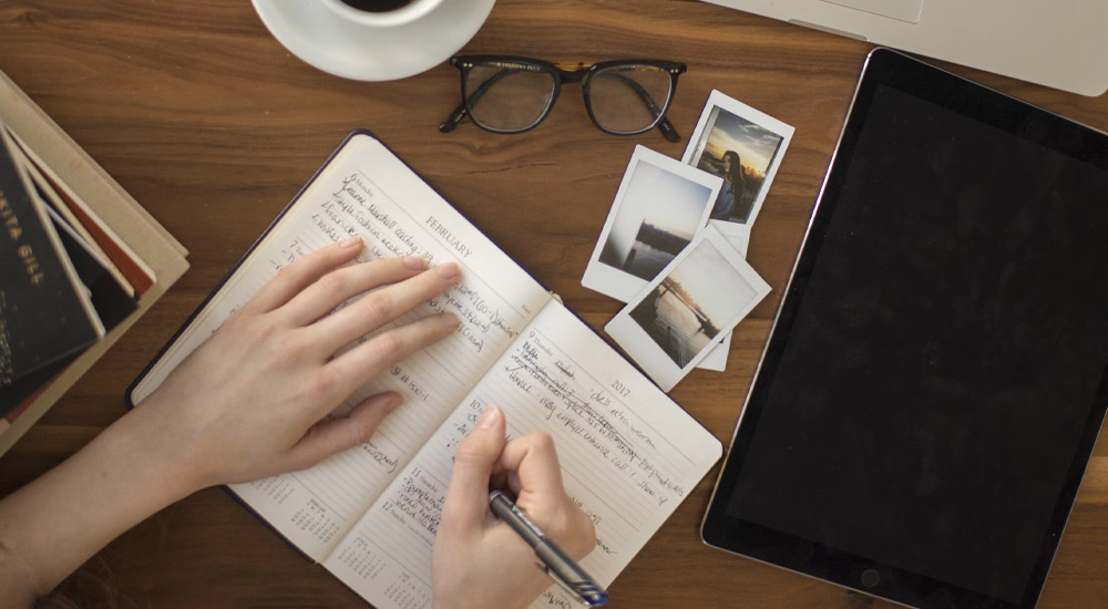 Shows a notebook, relating to comprehensive assessment for Recovery Without Walls patients