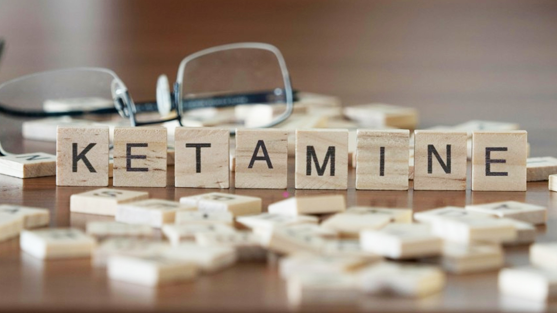 Shows scrabble tiles spelling "Ketamine"